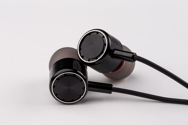 A set of wired in-ear buds | Image by snsforyou from Pixabay